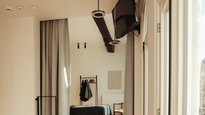 A modern interior with a wooden staircase leading to a bedroom. - A Place - Oude Koornmarkt 1 (Antwerp)