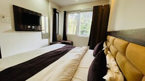 Comfort Double Room | Bed sheets - Hotel Wisteria by Mudras (Haridwar)
