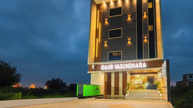 A modern building with a sign reading "GAUR VASUNDHARA". - Treebo Gaur Vasundhara (Vrindavan)
