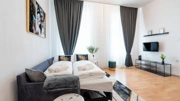 Design Apartment, Pets Allowed, City View | Living area | 43-inch Smart TV with digital channels