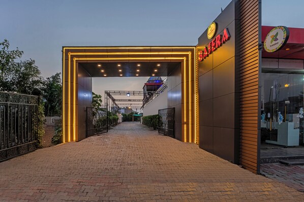 A building entrance with a sign reading "MASERA" and a logo for "treebo".