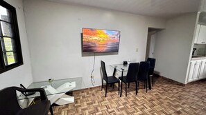 Family Apartment, 2 Bedrooms | Living room | 50-inch Smart TV with digital channels