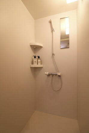 Shower, free toiletries, hair dryer, slippers