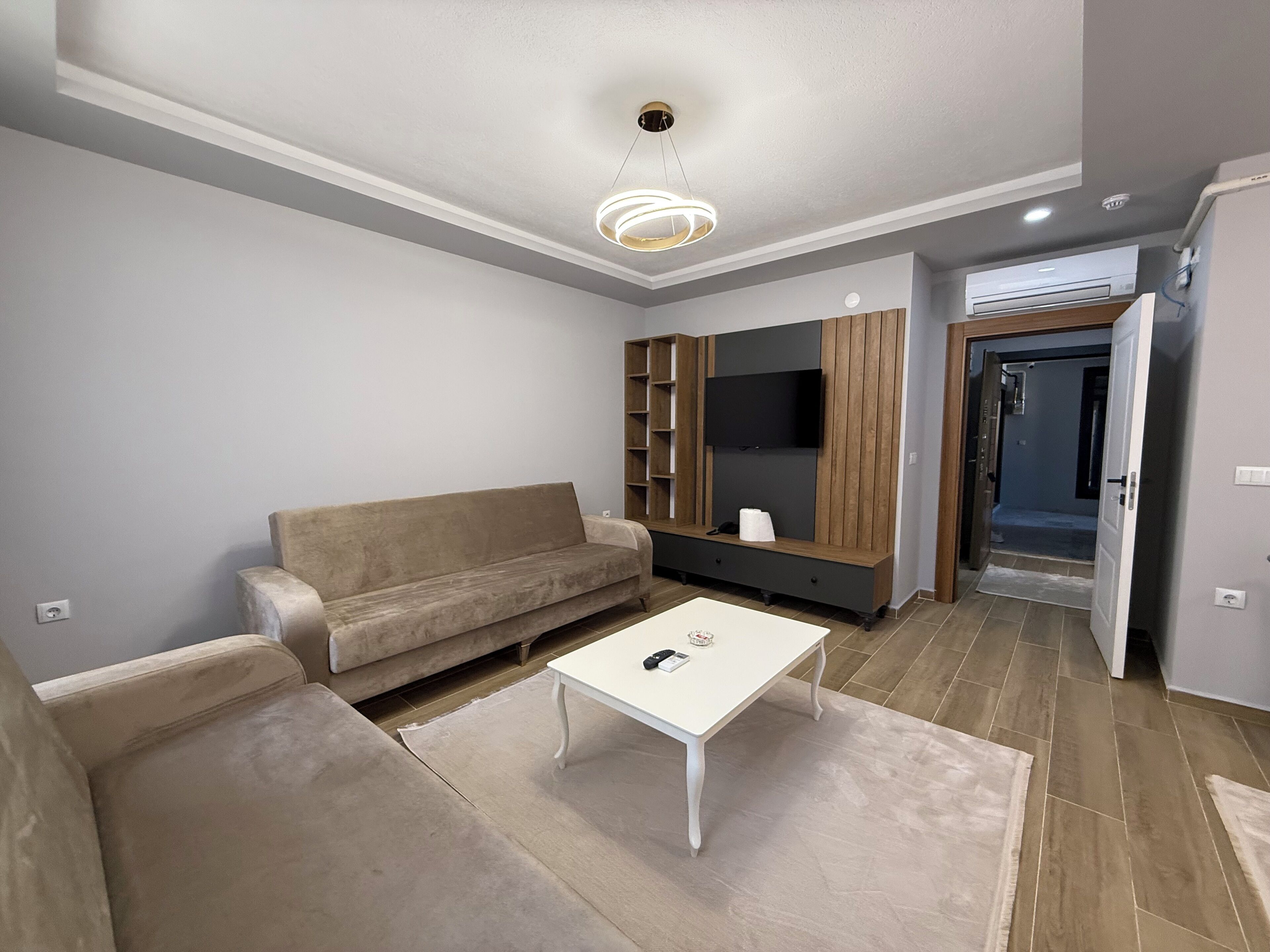 Deluxe Apartment, Balcony, Garden View | Living area | 108-cm Smart TV with satellite channels, heated floors, printers