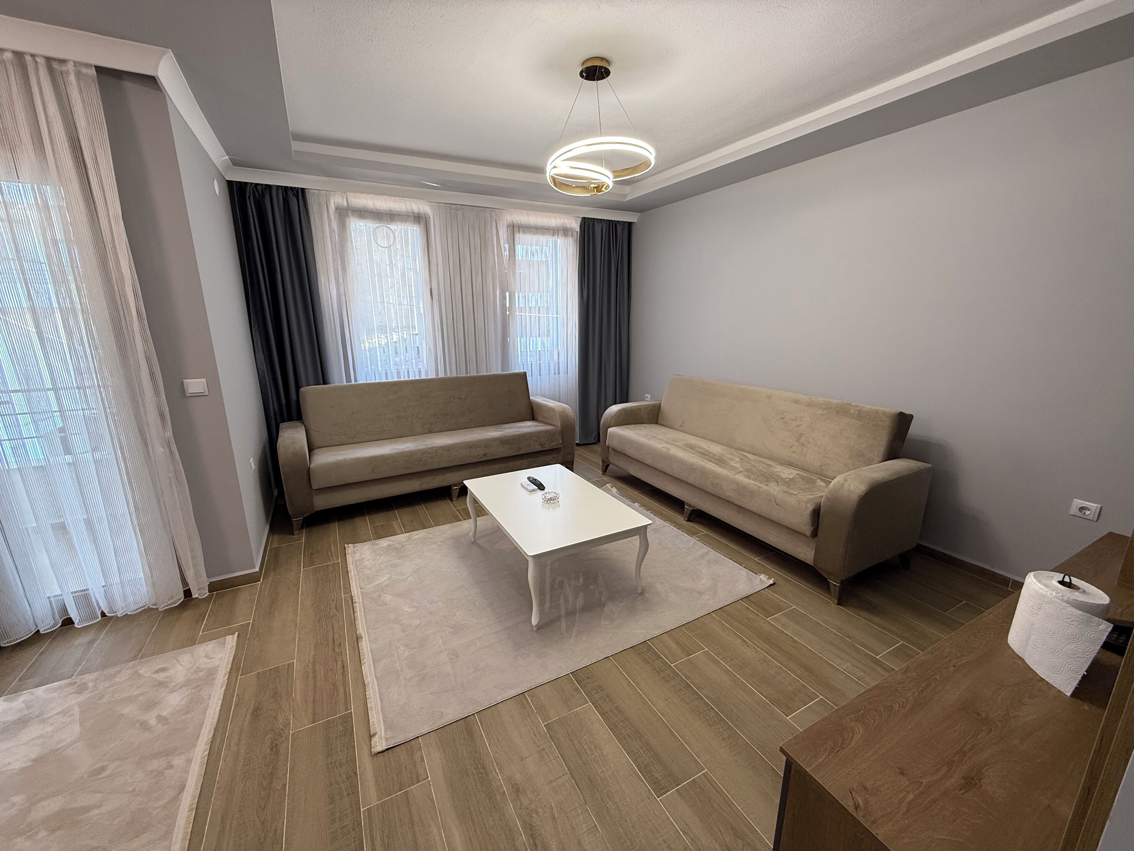 Deluxe-Apartment, Balkon, Gartenblick | Wohnbereich