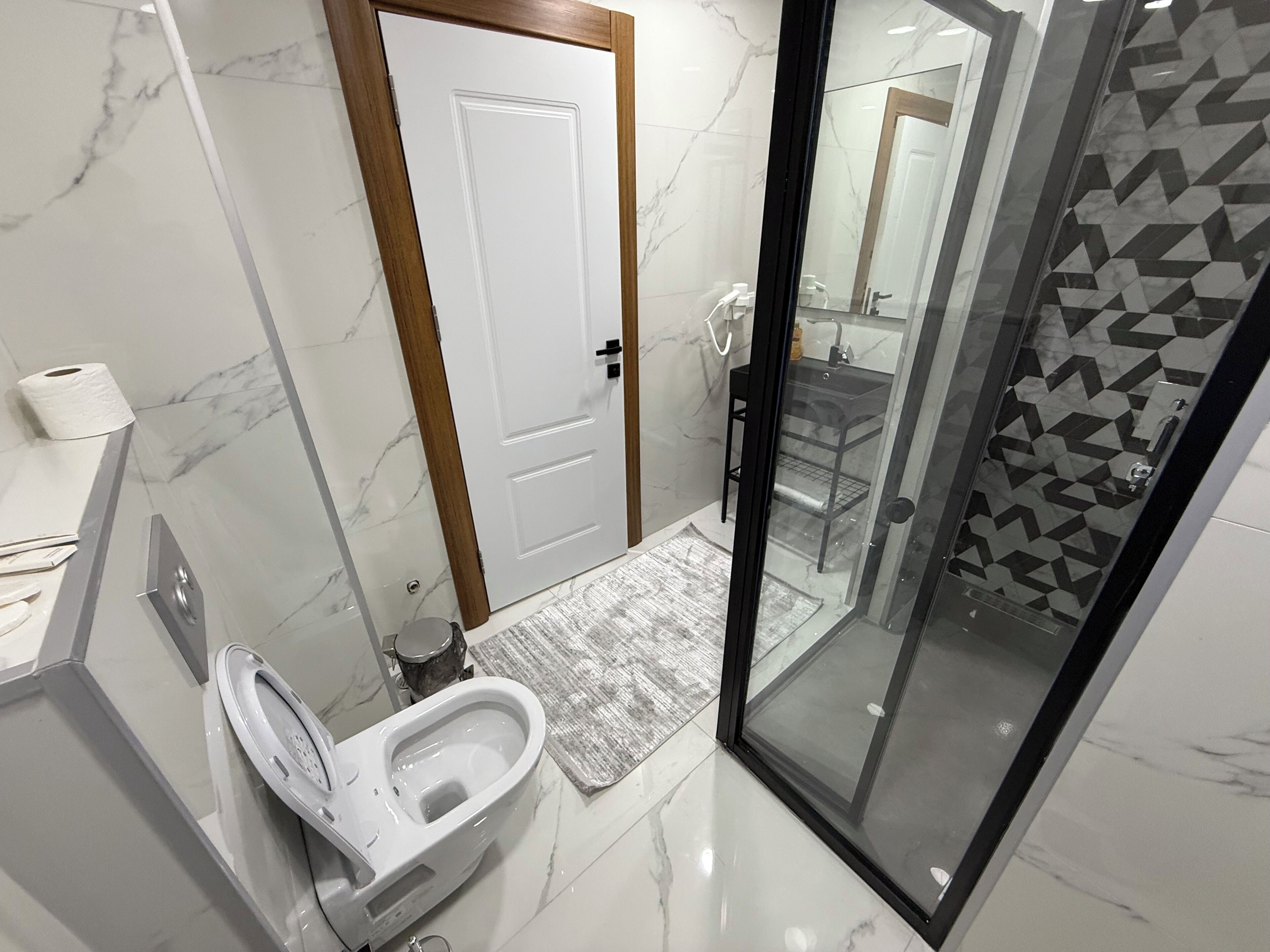 Deluxe Apartment, Balcony, Garden View | Bathroom | Shower, hair dryer, slippers, heated floors