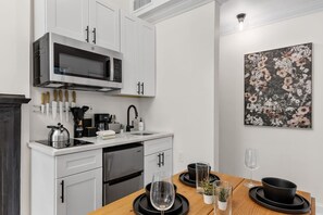 Microwave, stovetop, coffee/tea maker, dining tables