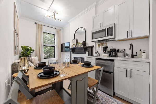 Microwave, stovetop, coffee/tea maker, dining tables