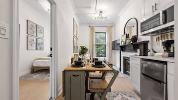 Microwave, stovetop, coffee/tea maker, cookware/dishes/utensils