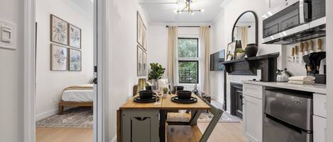 Microwave, stovetop, coffee/tea maker, dining tables