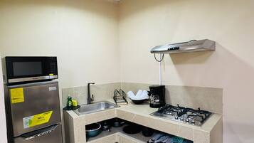 Fridge, coffee/tea maker, cookware/dishes/utensils