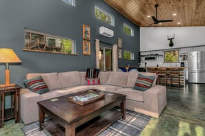 Signature House, 2 Bedrooms, Non Smoking, Pets allowed | Living room | 49-inch Smart TV with digital channels, books