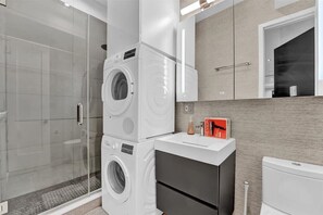 Shower, hair dryer, towels