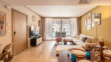 Apartment | Living area | 55-inch Smart TV with satellite channels