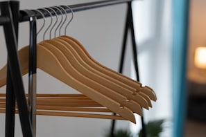 A clothing rack with multiple hangers.