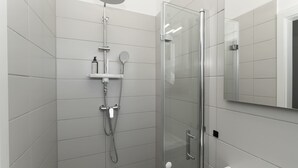 A modern bathroom with a glass shower enclosure, a white sink, and a mirror. - LiT LiVING: Luxus | Box SprIng | Kitchen | Parking (Altenstadt)