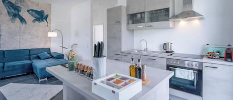 Fridge, stovetop, dishwasher, coffee/tea maker