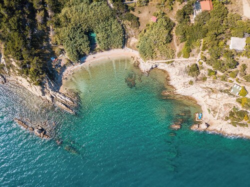 Unique place at the cliff, secluded mediterranean habitat, two beaches.
