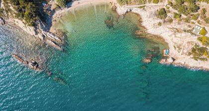 Unique place at the cliff, secluded mediterranean habitat, two beaches.