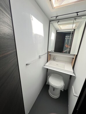 Shower, hair dryer, towels, toilet paper