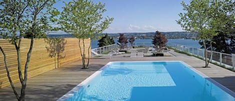 Outdoor pool, open 7:00 AM to 10:00 PM, free cabanas, pool umbrellas