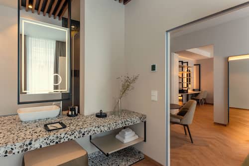 Grand LOVIS | Bathroom | Eco-friendly toiletries, hair dryer, slippers, towels