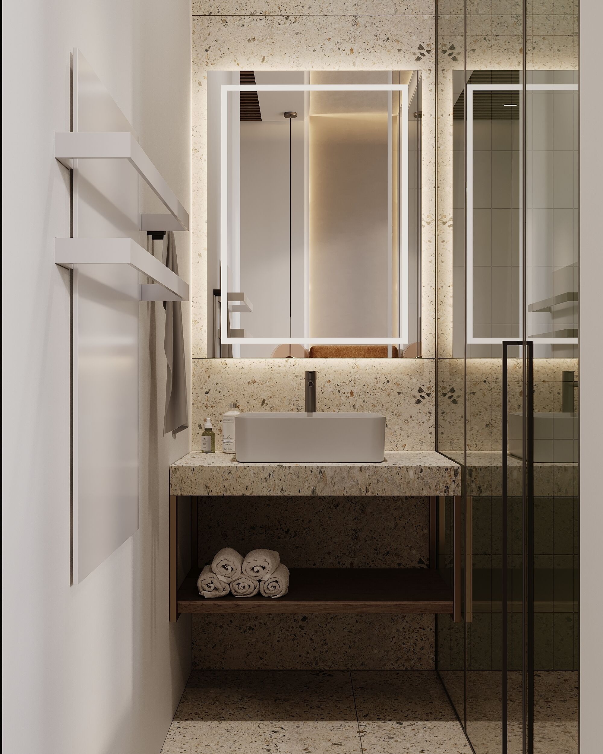 Un baño moderno con un lavamanos rectangular, un espejo grande y una cabina de ducha de vidrio.