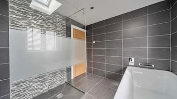 Separate bathtub and shower, deep-soaking bathtub, hair dryer, towels