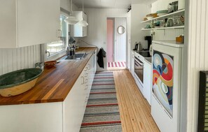 Fridge, stovetop, dishwasher, coffee/tea maker