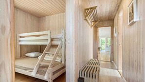 A wooden cabin interior with a bunk bed, a ladder, and a small window. - 4 bedroom nice home in Glesborg (Glesborg)