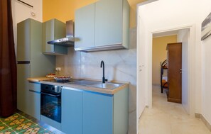 Fridge, coffee/tea maker, cookware/dishes/utensils