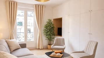 Standard Apartment, Courtyard View | Living area | 80-cm Smart TV with digital channels