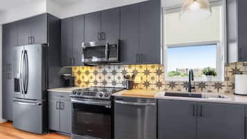 Condo, 1 Queen Bed with Sofa bed, Balcony (Creekside Modern) | Private kitchen | Fridge, microwave, oven, stovetop