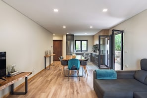 Apartment, River View | Living area | Flat-screen TV