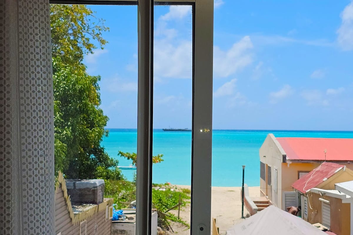 Comfort Room, 1 King Bed, Non Smoking, Ocean View | Desk, laptop workspace, iron/ironing board, free WiFi