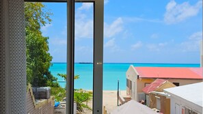 Comfort Room, 1 King Bed, Non Smoking, Ocean View | Desk, laptop workspace, iron/ironing board, free WiFi