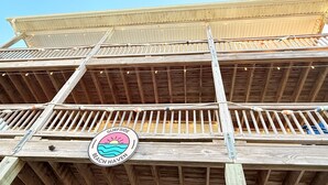 A wooden structure with a logo that reads "SURFSIDE BEACH HAVEN". - Amazing ocean views, Sleeps 8, Beach access, Pets OK (Surf City)