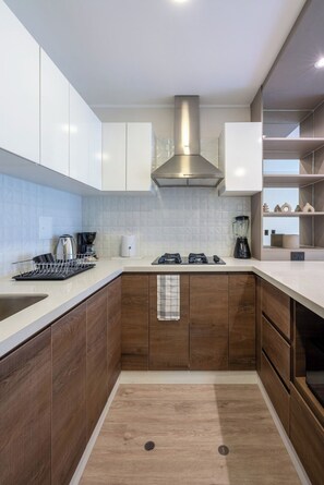Fridge, microwave, stovetop, coffee/tea maker