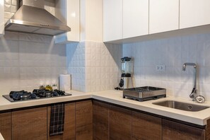 Fridge, microwave, stovetop, coffee/tea maker