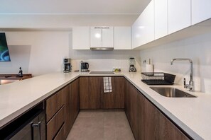 Microwave, stovetop, coffee/tea maker, cookware/dishes/utensils