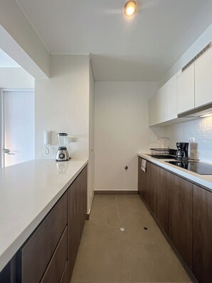 Fridge, microwave, stovetop, coffee/tea maker