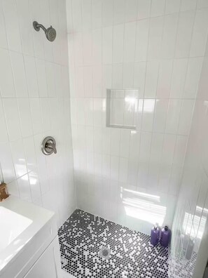 Shower, hair dryer, towels, soap