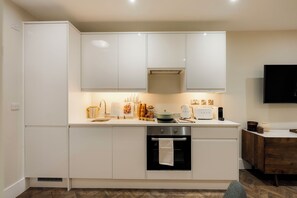 Fridge, dishwasher, toaster, dining tables