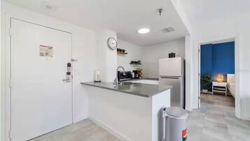 Microwave, stovetop, dishwasher, coffee/tea maker