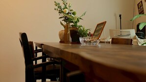 A dining table with chairs, a potted plant, and a laptop. - Japanese-style family house in the western of Tokyo, DP Oyamamachi　 (町田市小山町)