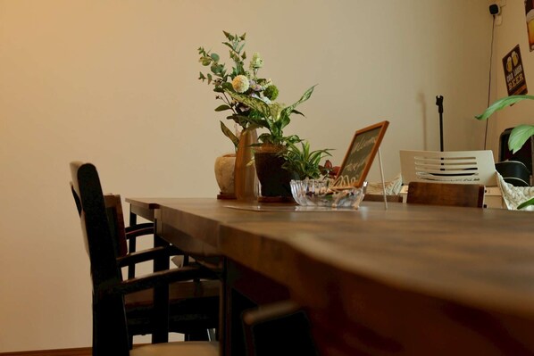 A dining table with chairs, a potted plant, and a laptop. - Japanese-style family house in the western of Tokyo, DP Oyamamachi (町田市小山町)
