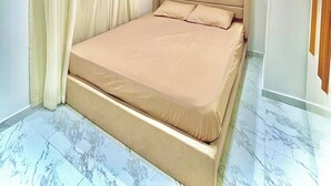 A modern bedroom with a large bed, a ceiling light, and a marble floor. - Your Unique home in cairo (Cairo)