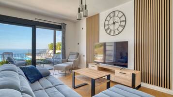 Luxury Apartment, Sea View | Living area | 45-inch LCD TV with satellite channels