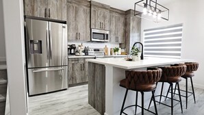 Coffee/tea maker, fridge, microwave, oven