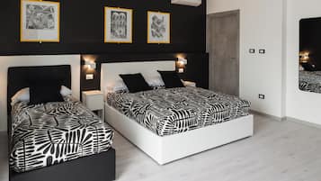 Triple Room | In-room safe, desk, laptop workspace, blackout drapes
